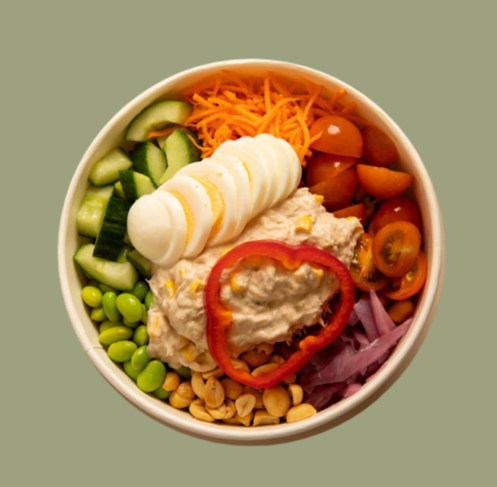 Salad bowl with tuna salad and egg.
