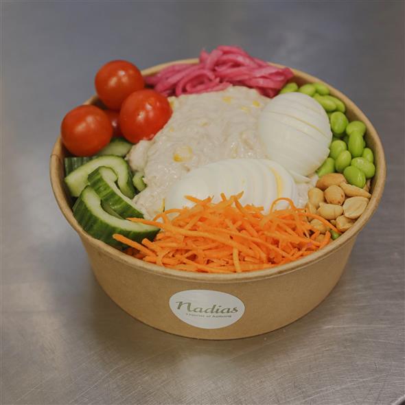 Salad bowl with tuna salad and egg.